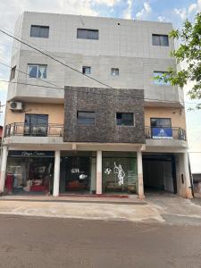 a store front of a building with graffiti on it at Departamentos Imperial in Encarnación