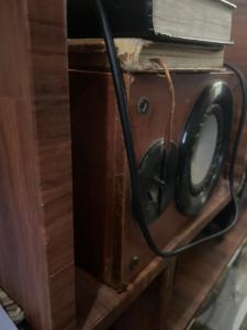 a pair of scissors sitting on top of a wooden cabinet at Paasam Gh in Takoradi