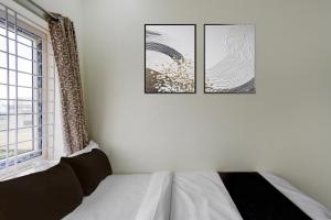 Ένα ή περισσότερα κρεβάτια σε δωμάτιο στο Hotel O The Dream Inn