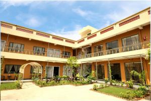 an exterior view of a building with a courtyard at Kunj - A Boutique Hotel By Shivaneel Hospitality in Pushkar