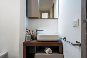 a bathroom with a sink and a mirror at Loft San Basilio in Palermo +16 photos