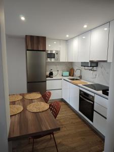 Η κουζίνα ή μικρή κουζίνα στο Sea and Sand Apartment +5 φωτογραφίες