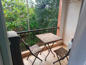 a balcony with a table and two chairs on a balcony at Heritage Holiday home's Studio apartment 500 sqft in Arpora