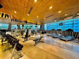 a gym with a lot of treadmills and machines at L Studio by Sella in Manila