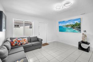 a living room with a couch and a view of the ocean at Costerra Miami 2BR in Miami