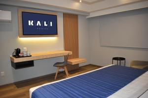 a hotel room with a bed and a tv on the wall at KALI Vallejo Mexico City in Mexico City +30 photos