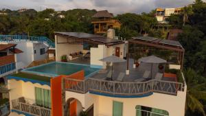 an aerial view of a house with a swimming pool at Villa Los Corales in Sayulita