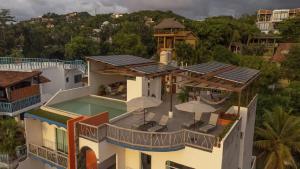 an aerial view of a house with a swimming pool at Villa Los Corales in Sayulita