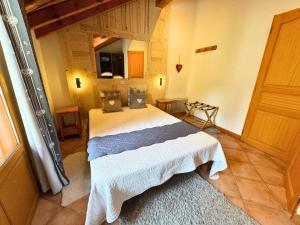 Postel nebo postele na pokoji v ubytování Résidence Marie Gros - CHALET | ST MARTIN DE BELLEVILLE MAE-4364