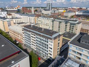 an aerial view of a city with tall buildings at Homelike Studio at the Very Center of Downtown Tampere in Tampella +5 photos