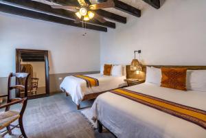 Ένα ή περισσότερα κρεβάτια σε δωμάτιο στο Casa Yuca Hotel Boutique