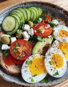 a plate of eggs and tomatoes with cucumbers and vegetables at pYramids sun hOtel in Cairo