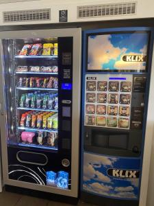 two vending machines with drinks and drinks in them at Hôtel F1 Verdun in Verdun