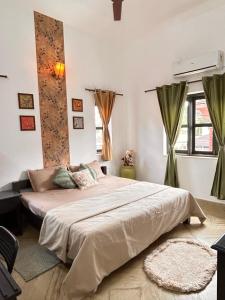 a bedroom with a large bed in a room at Alaansh Villa Perfect Backyard & BBQ Retreat in Assagao +54 photos