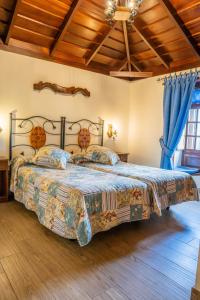 En eller flere senge i et værelse på Casa Rural Monte del Agua