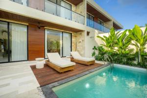an image of a house with a swimming pool at White Residence by Iji in Uluwatu