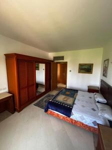 a bedroom with a large bed in a room at apartment on the beach inside a hotel in Sharm El Sheikh +8 photos
