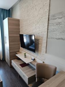 Телевизор и/или развлекательный центр в Mantera Apartmani