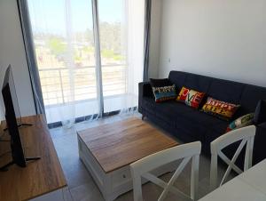 a living room with a couch and a coffee table at LJ Park Penthouse North Cyprus 
