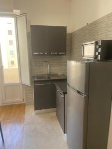 Η κουζίνα ή μικρή κουζίνα στο Logudoro Flat +21 φωτογραφίες
