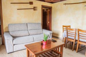 a living room with a couch and a table at Casa Rural Monte del Agua in Los Silos