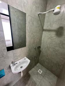 a bathroom with a sink and a mirror at Shamzluxury2 in Nairobi