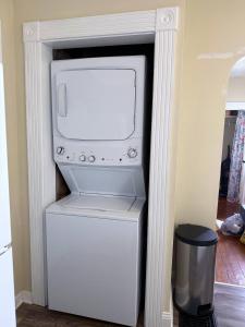 a microwave sitting on top of a refrigerator at The Riverstone Getaway in historical Madison, IN in Madison