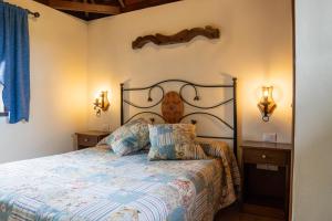 En eller flere senge i et værelse på Casa Rural Monte del Agua