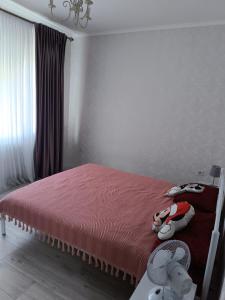 Ένα ή περισσότερα κρεβάτια σε δωμάτιο στο Апарт-Отель Rozi +3 φωτογραφίες