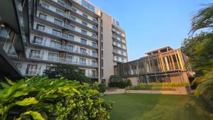 an apartment building with a lawn in front of it at The Lennox Suites by Cozy in Accra