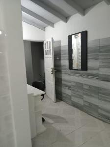 a bathroom with a sink and a mirror on the wall at Casa Teresa in El Talar de Pacheco +18 photos