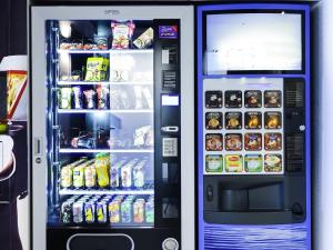 a vending machine filled with food and drinks at ibis budget Bayonne in Bayonne