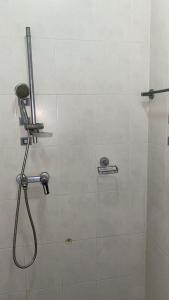 a shower in a bathroom with a shower head at Petit palais in Dakar