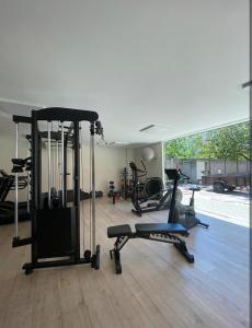 a gym with treadmills and exercise equipment in a room at Golden lake apartamento com linda vista para piscina in Arraial do Cabo