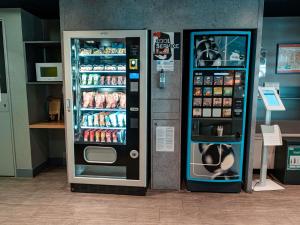 two vending machines are next to each other at ibis budget Narbonne Est in Narbonne