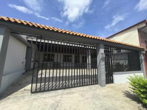 an iron gate in front of a building at Sweeeet Home Alajuela! in Alajuela City