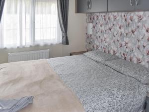 Ένα ή περισσότερα κρεβάτια σε δωμάτιο στο Sunnyside Lodge