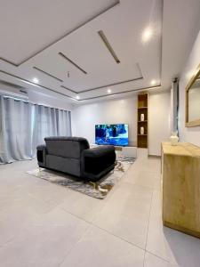 TV a/nebo společenská místnost v ubytování Appartement meublé 2 chambre salon