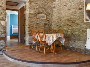 a dining room with a table and chairs at Byre Cottage - Uk50028 in Liskeard