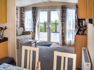 En eller flere senge i et værelse på Ocean Drive