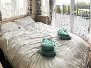 En eller flere senge i et værelse på Ocean Drive + 6 billeder