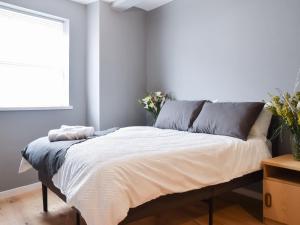 a bed in a room with a window at Apartment 1 - Uk50135 in Stoke on Trent