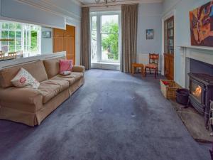 a living room with a couch and a fireplace at Escowbeck House in Lancaster