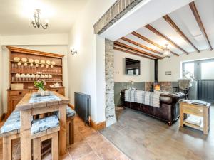 a living room with a couch and a table at Shire - Uk49791 in Cribyn