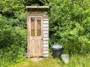an out house with a window and a bucket at Water Vole - Uk49931 in Shadoxhurst