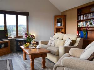 Et opholdsområde på Buckswell Cottage