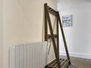 a ladder leaning against a wall next to a radiator at Headland View in Scarborough