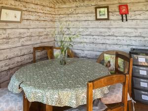 a table and chairs with a vase on top of it at Sweet Briar - Uk49797 in Brecon