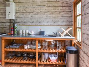 a kitchen with a sink and a shelf with dishes at Sweet Briar - Uk49797 in Brecon +8 photos