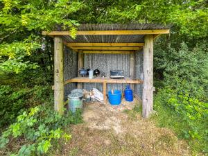 a wooden shed with pots and pans in it at Barn Owl - Uk49932 in Shadoxhurst